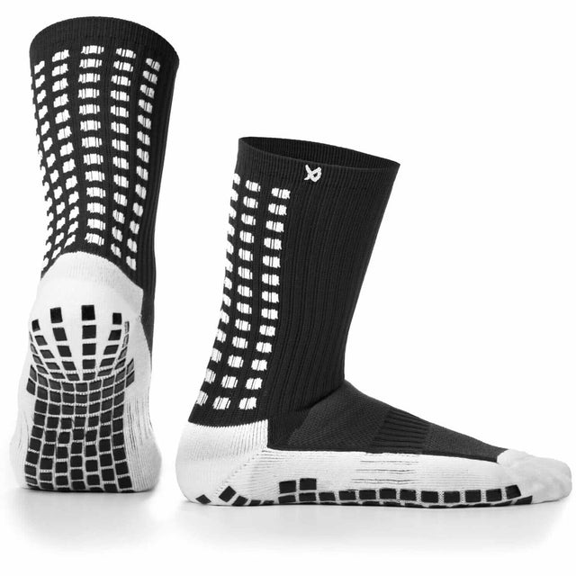 Black and white LUX anti-slip football socks for men with grip technology.