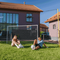Backyard football goal for kids with built-in rebound feature