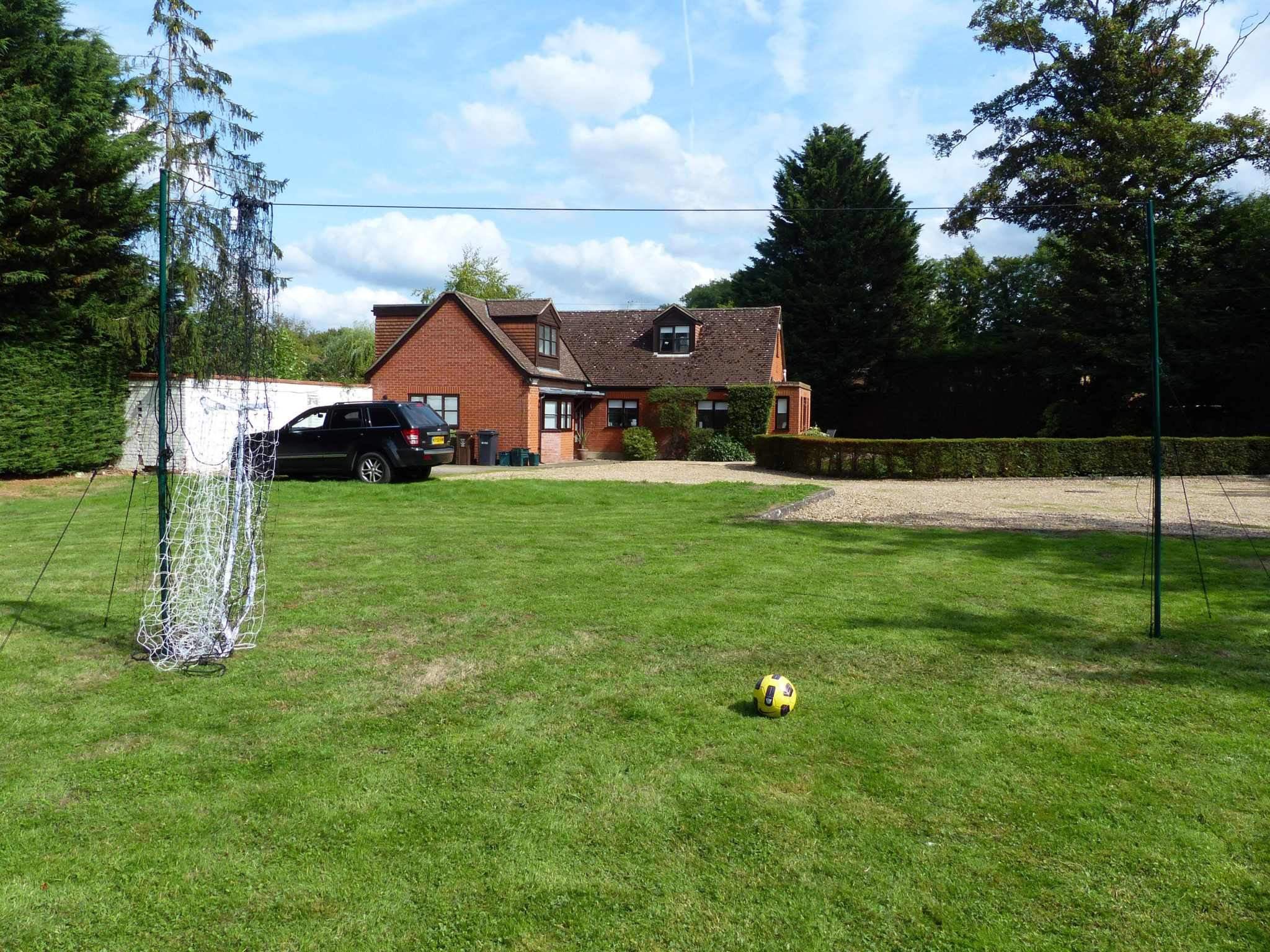 Football goal rebounding a ball after a powerful kick